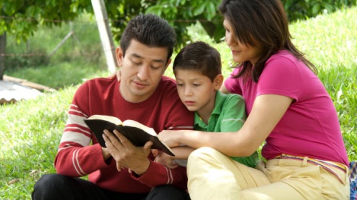 Family enjoying Bible study in nature